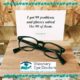 Glasses in front of a sign reading "I got 99 problems and glasses solved like 90 of them."