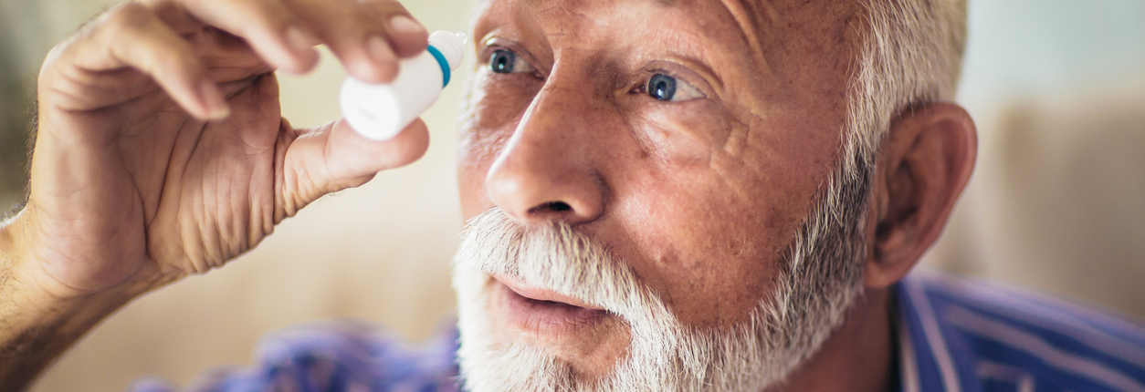 Elderly Person Using Eye Drops