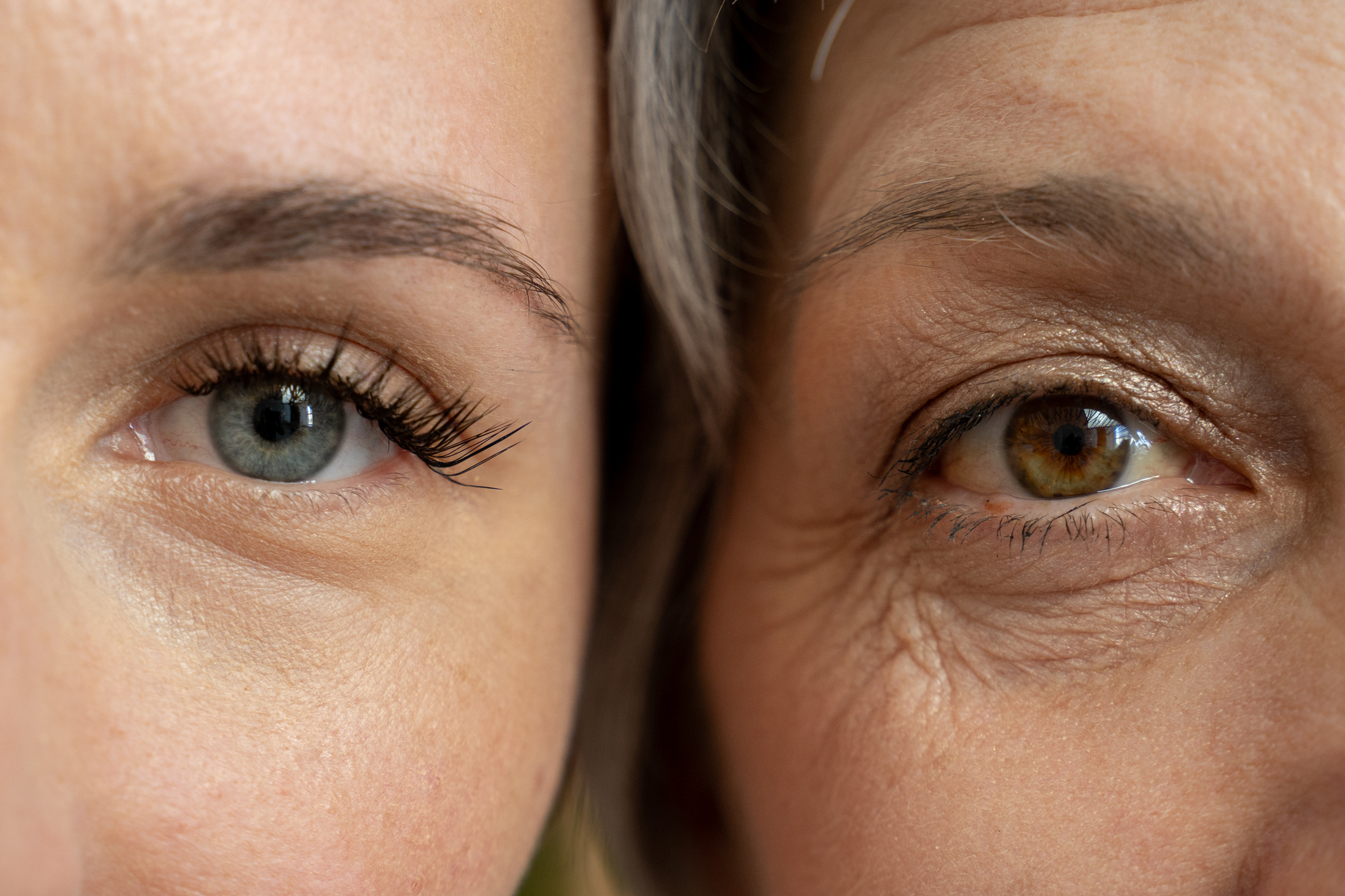Image of two woman with faces next to each other showing their eyes.