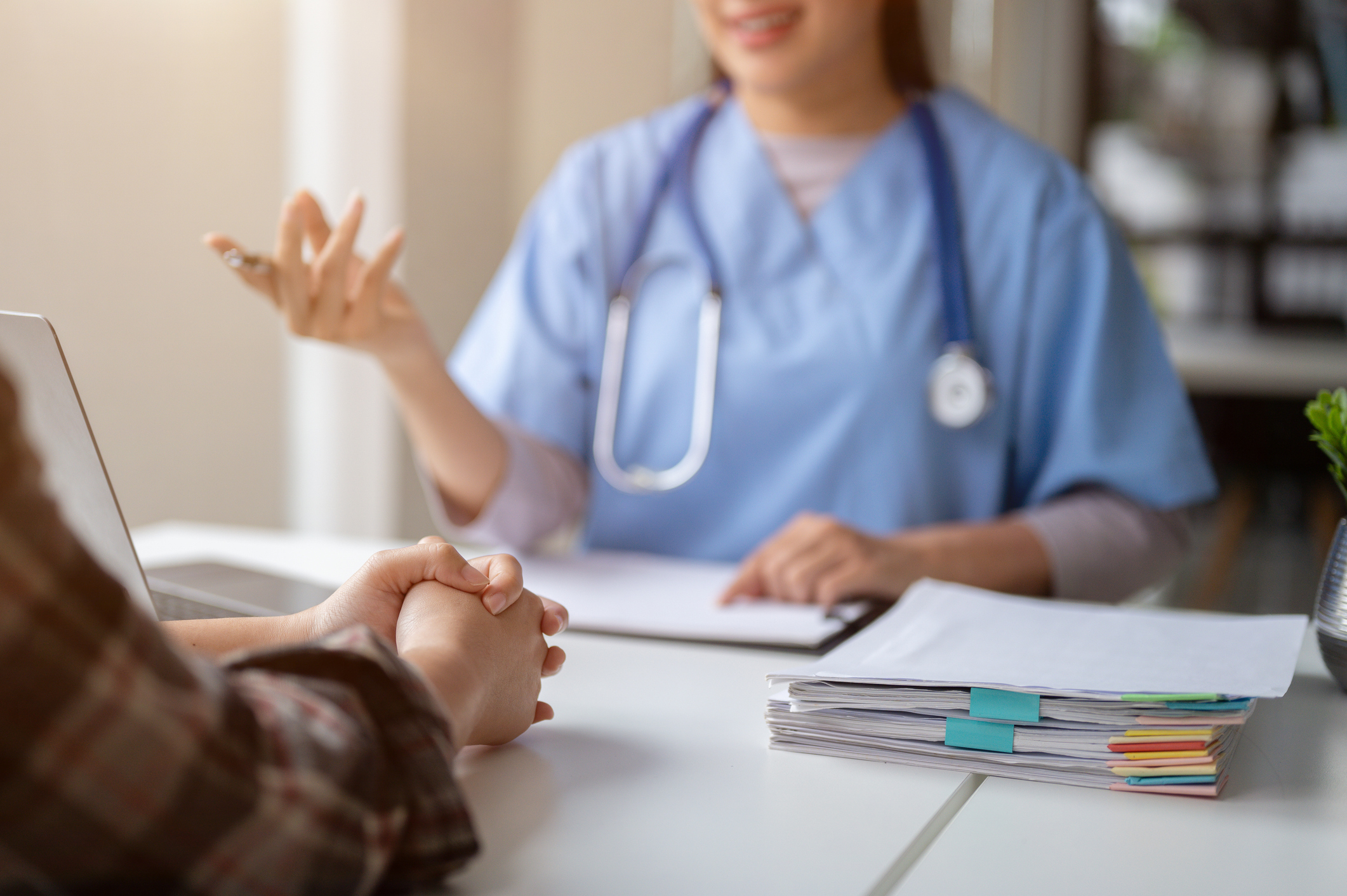 Image of a doctor having a discussion with a patient about their medical history.