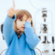 Toddler child pointing to a vision chart during eye check
