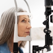 Elderly woman getting her eye checked at the optometrist