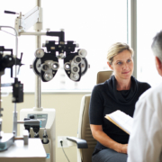 A woman listens to her opthamologist